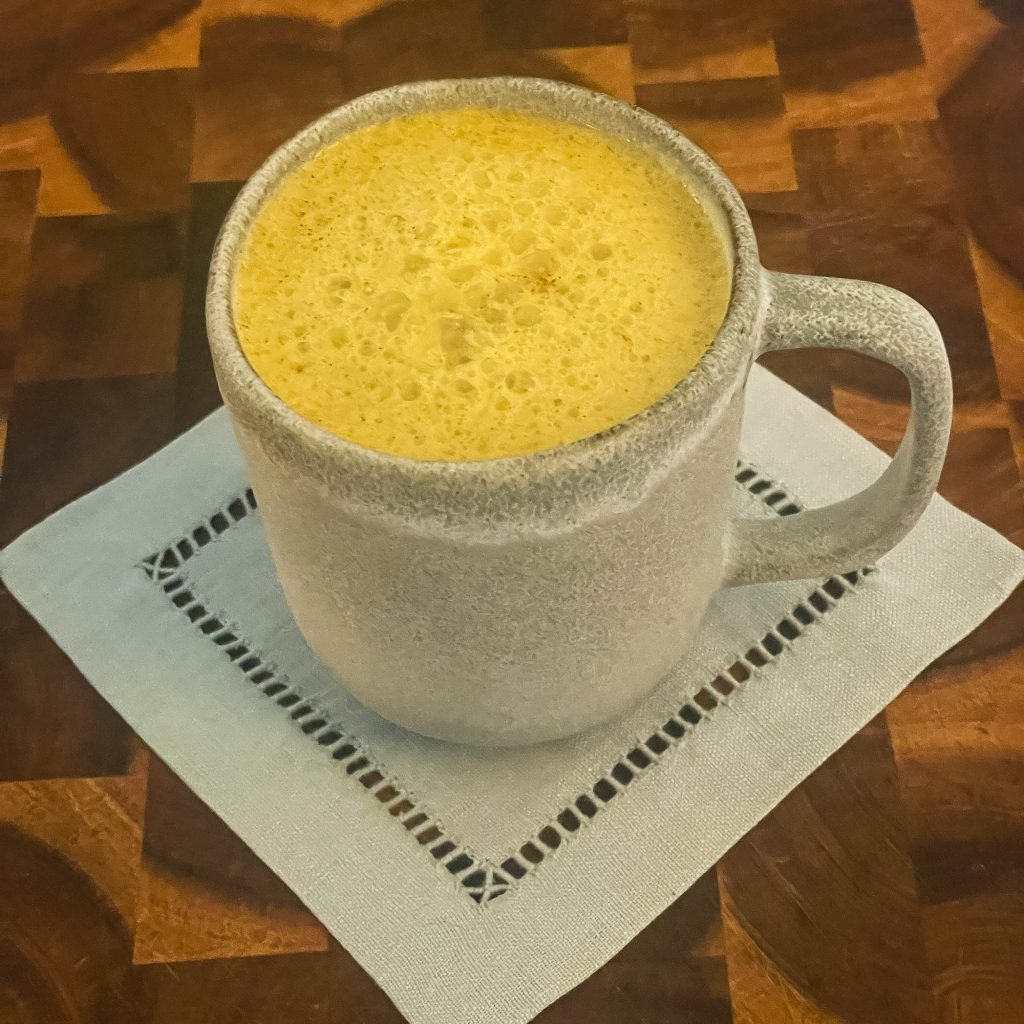 a cup of golden turmeric latte