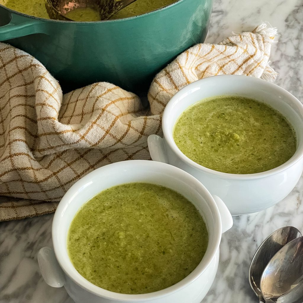 two bowls of cream of asparagus soup