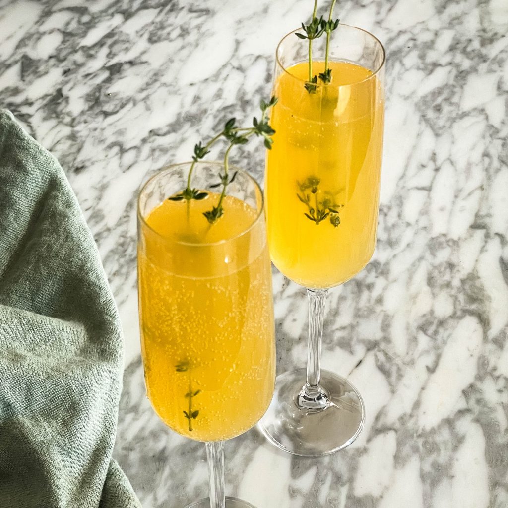 two glasses of spring thyme Bellini