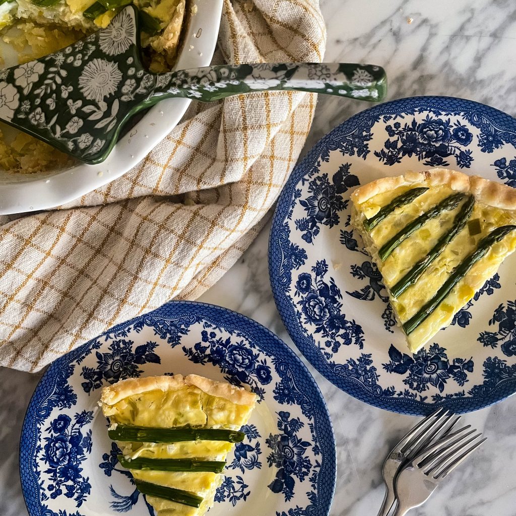 top view of sliced asparagus and goat cheese quiche